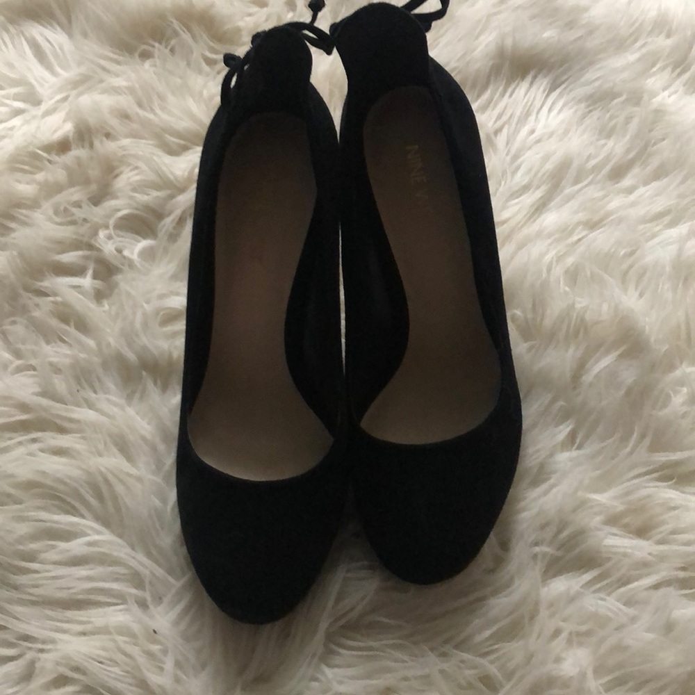 Black suede high heeled pumps